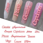 Demonstration of zodiac hollow letter charms applied onto glossy salon gel nails.