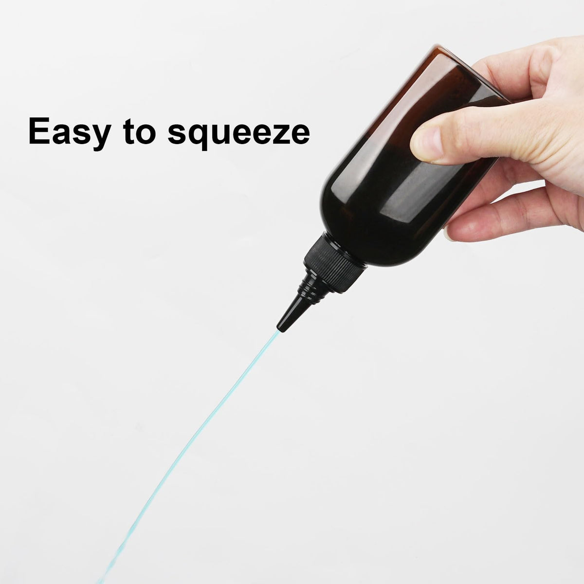 Cosywell travel size shampoo and hair dye plastic bottles being filled manually