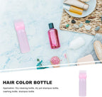 Side view of 6 Ounce hair oil applicator bottle showcasing liquid capacity lines.