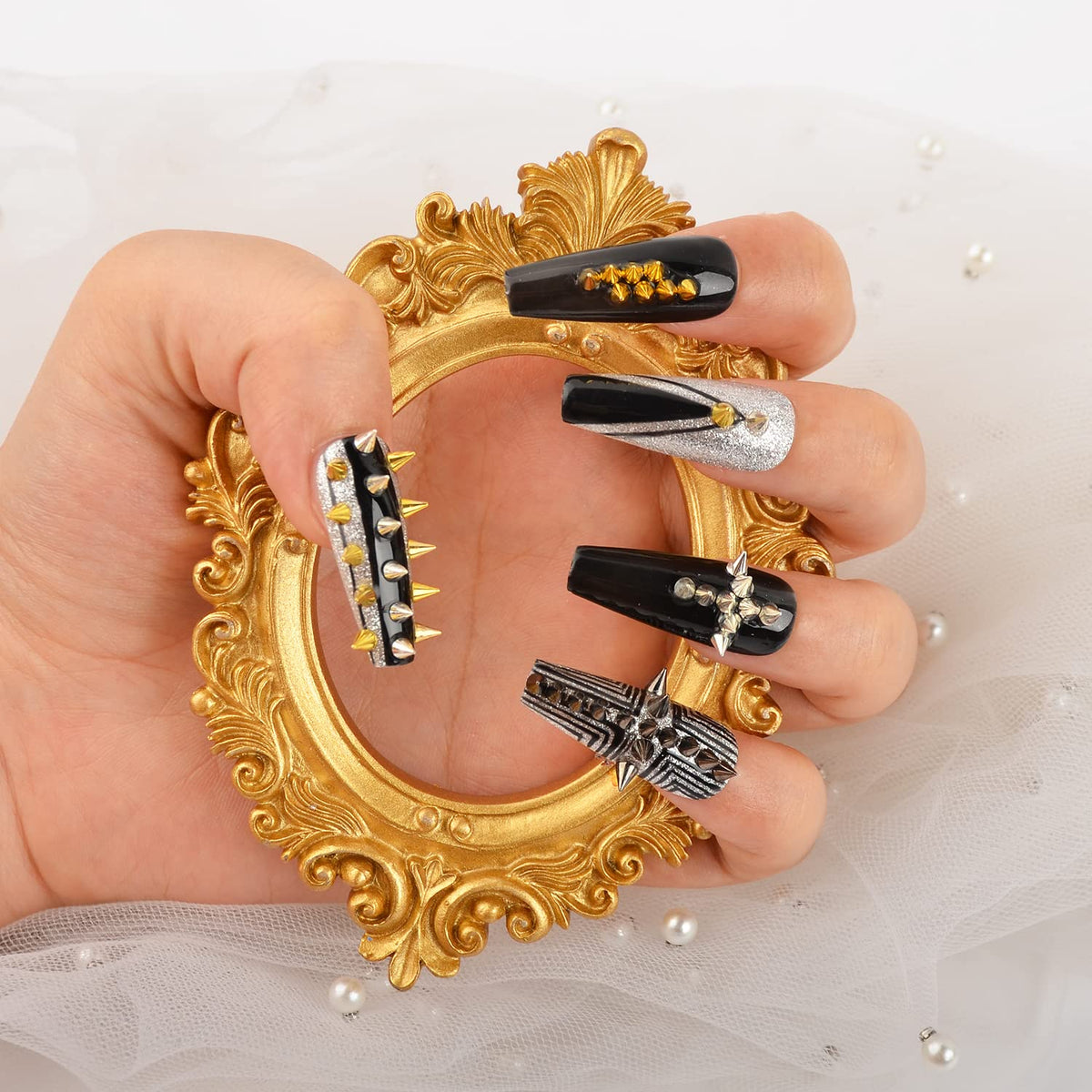 Full packaging of six hundred pieces of metallic nail embellishments demonstrating size comparison