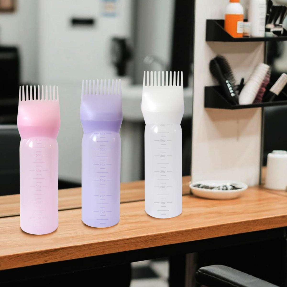 Three pack of YANTAISIYU reusable hair care bottles in pink white and purple colors