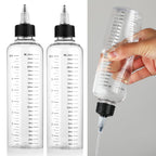Comnico empty plastic dispenser squeeze bottles showing the structural dimensions and clean clear build quality.