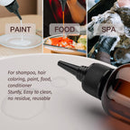 Close up of the precise pointed tip nozzle on the empty plastic squeeze bottle showing the open and close mechanism.