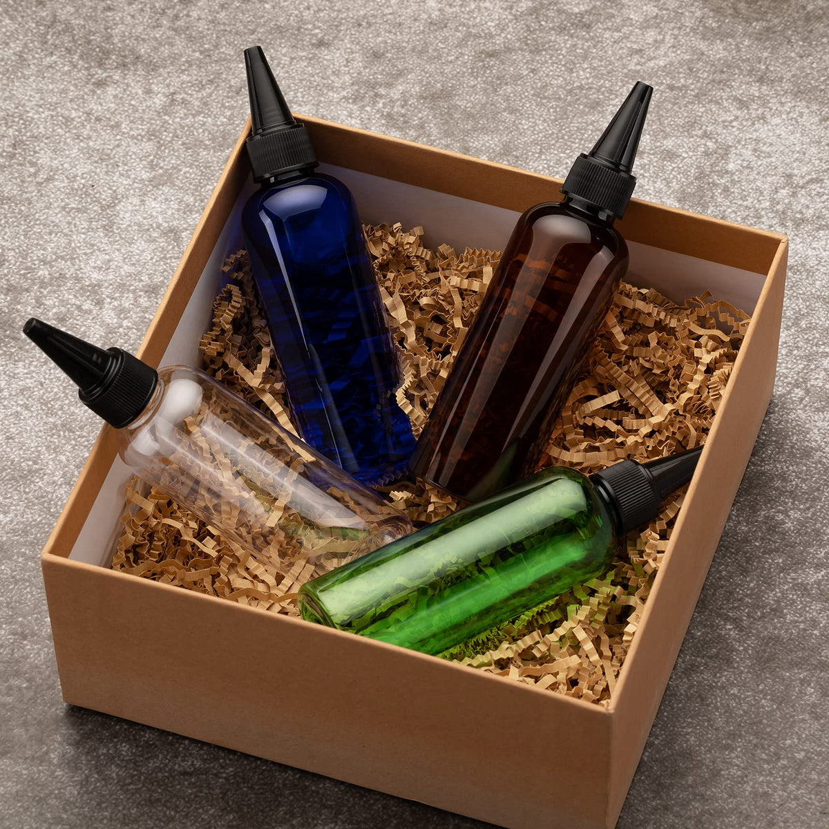The complete five piece travel size container set laid out with the included identification labeling stickers.