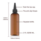 A hand gently compressing the flexible amber squeeze bottle to illustrate the high quality durable plastic texture.