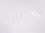 Close up of crystal clear gel nail strips on fingernails