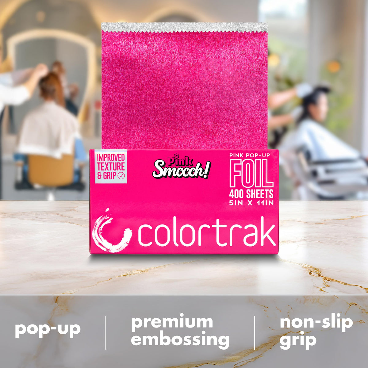 Professional hair stylist using Colortrak embossed foil