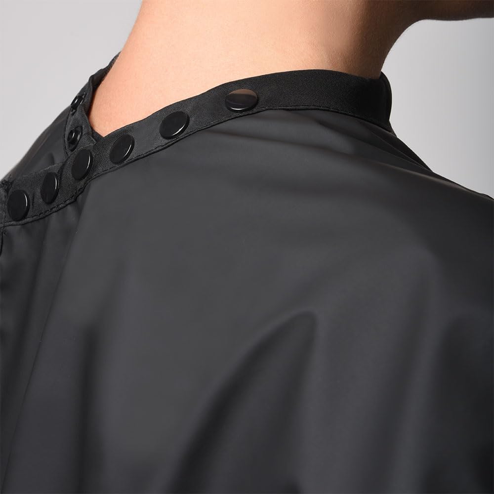 Framar salon cape showing adjustable snap closure details