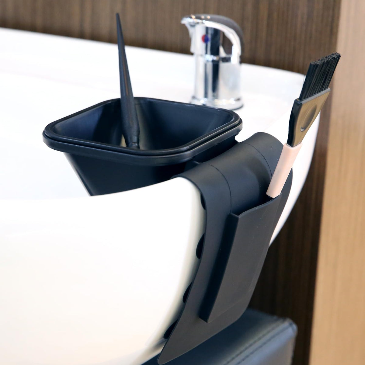 Stylist using the STYLANCE suction cup toning tub during a hair glaze service