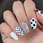 Maniology M475 Seeing Spots stamping plate close up detailing deep etched geometric designs.
