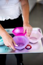 Hairstylist holding the connected seven pack FRAMAR color palette with one hand