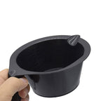 Professional hair dye tinting brush featuring integrated storage hook closeup