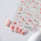 Close up of 5d raised strawberry and bow nail art decals