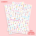 Close up of Xo, Fetti colorful heart and smiley face nail stickers