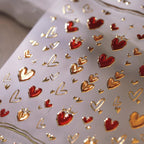 Red and gold heart nail art decals sheet