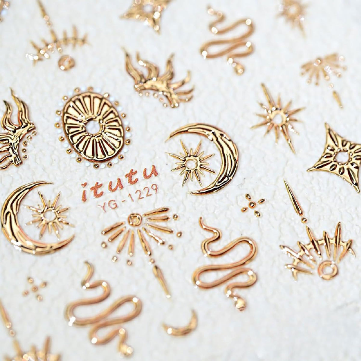 5D textured gold star nail stickers on a manicure