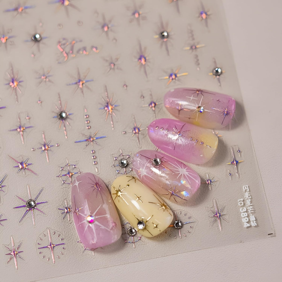 Three sheets of Namrec glitter star nail art stickers