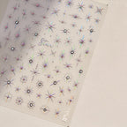 Hand model displaying 5D star nail art stickers