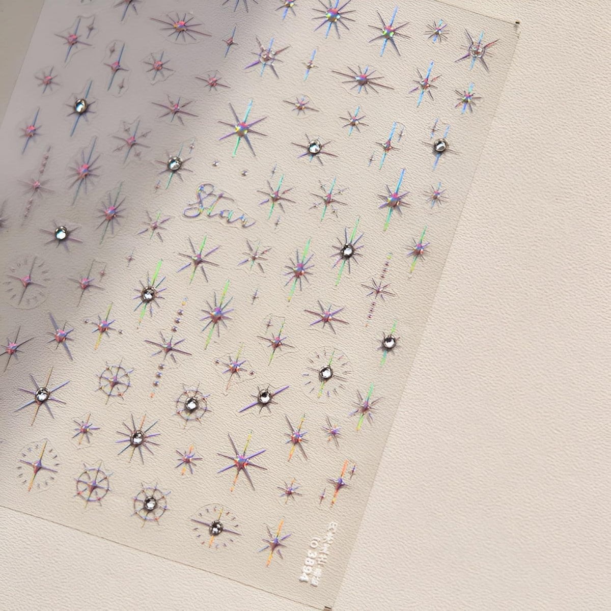 Hand model displaying 5D star nail art stickers