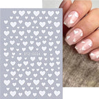 Applying self-adhesive nail stickers for DIY manicure