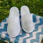 Individually wrapped disposable slippers for hotel and home guest use