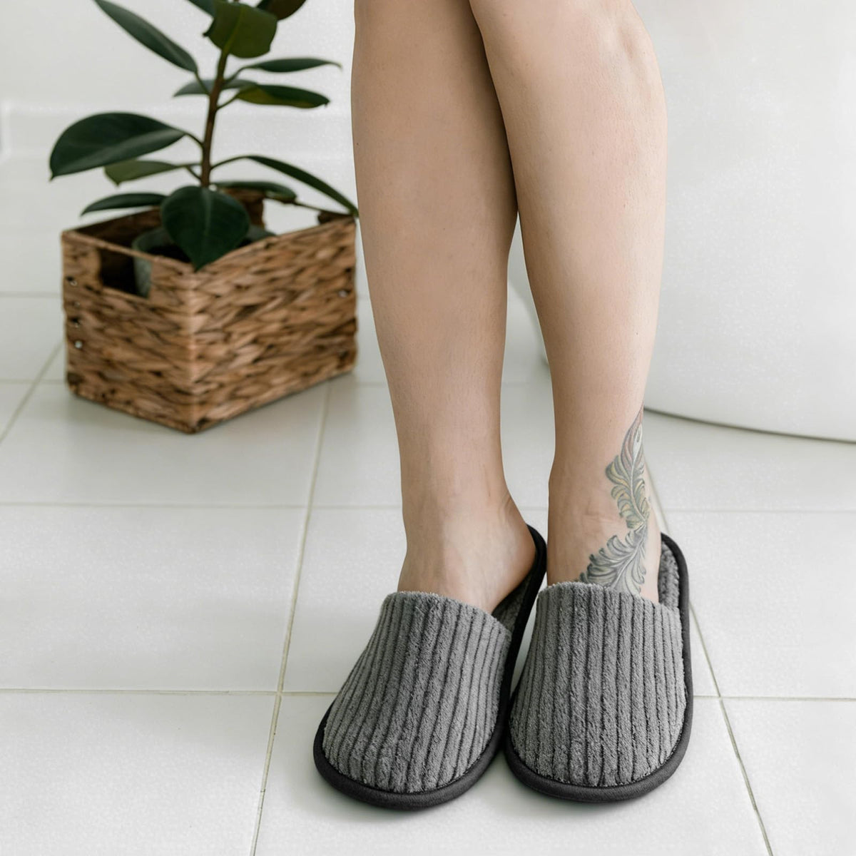 Tinsky branded disposable slippers stacked for guest convenience