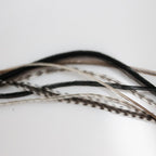 Side profile of feather extension in hair