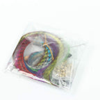 Variety of synthetic feather colors in the Soraka Hair kit