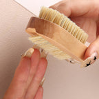 Side angle view showing the two different lengths of bristles on the wooden nail scrubber