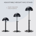Two packs of portable foldable black wig holders with dome tops.