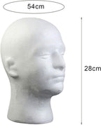 Male mannequin head model on a professional salon counter