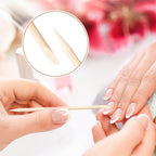 Using flat edge of orange wood stick for pushing cuticles