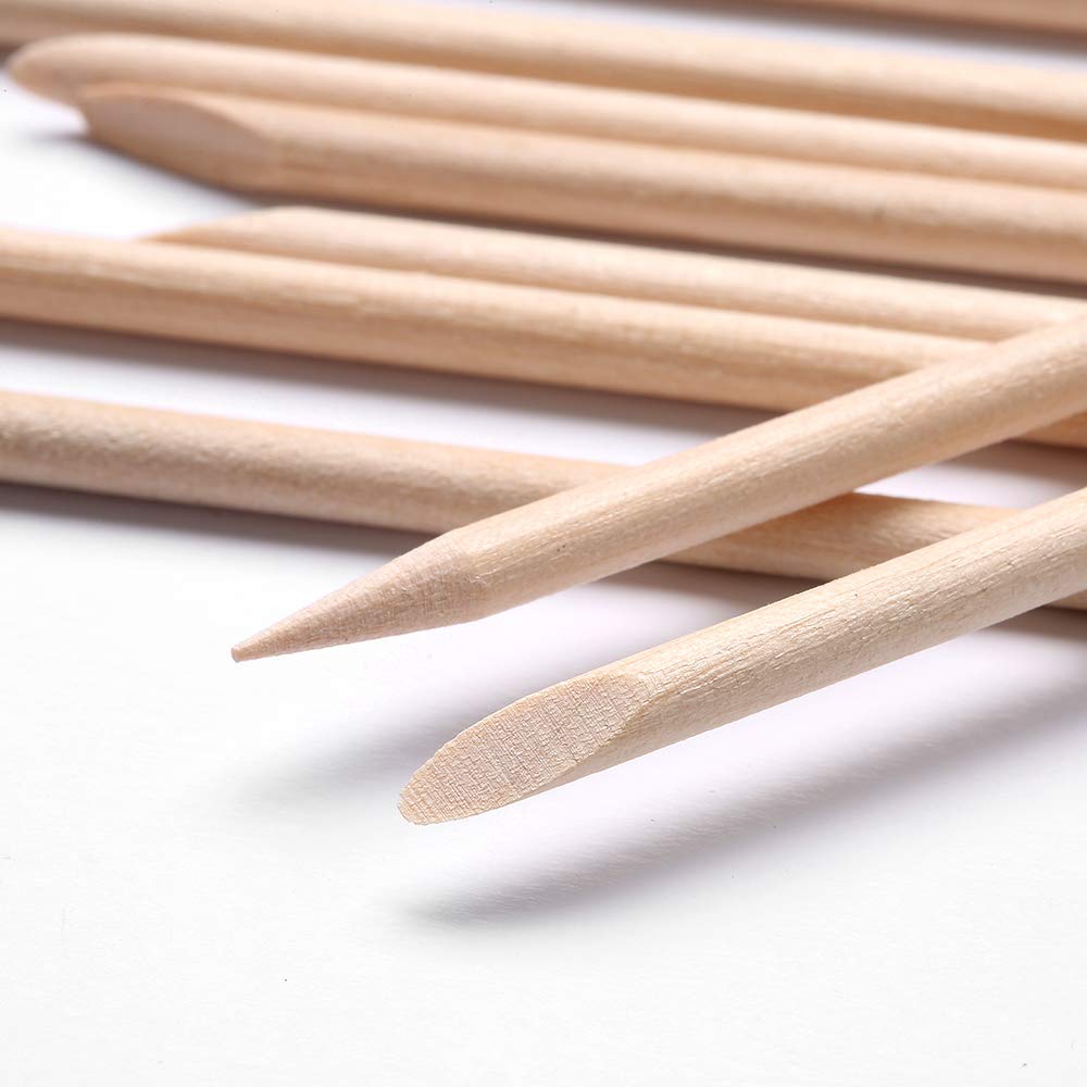 Professional nail care with orange wood sticks