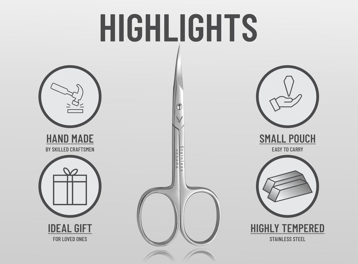 Vesara curved manicure scissors being held to demonstrate the lightweight ring handles