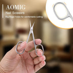 AOMIG stainless steel manicure scissors being used to trim dry cuticles safely