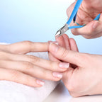 Three pieces of aquamarine blue pedicure nippers laid out flat