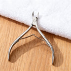 Side profile of the ergonomic salon-grade cuticle nipper illustrating the comfortable hand grip.