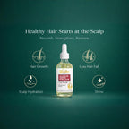 Applying a few drops of OilnGlow pre-shampoo serum directly to the scalp parting