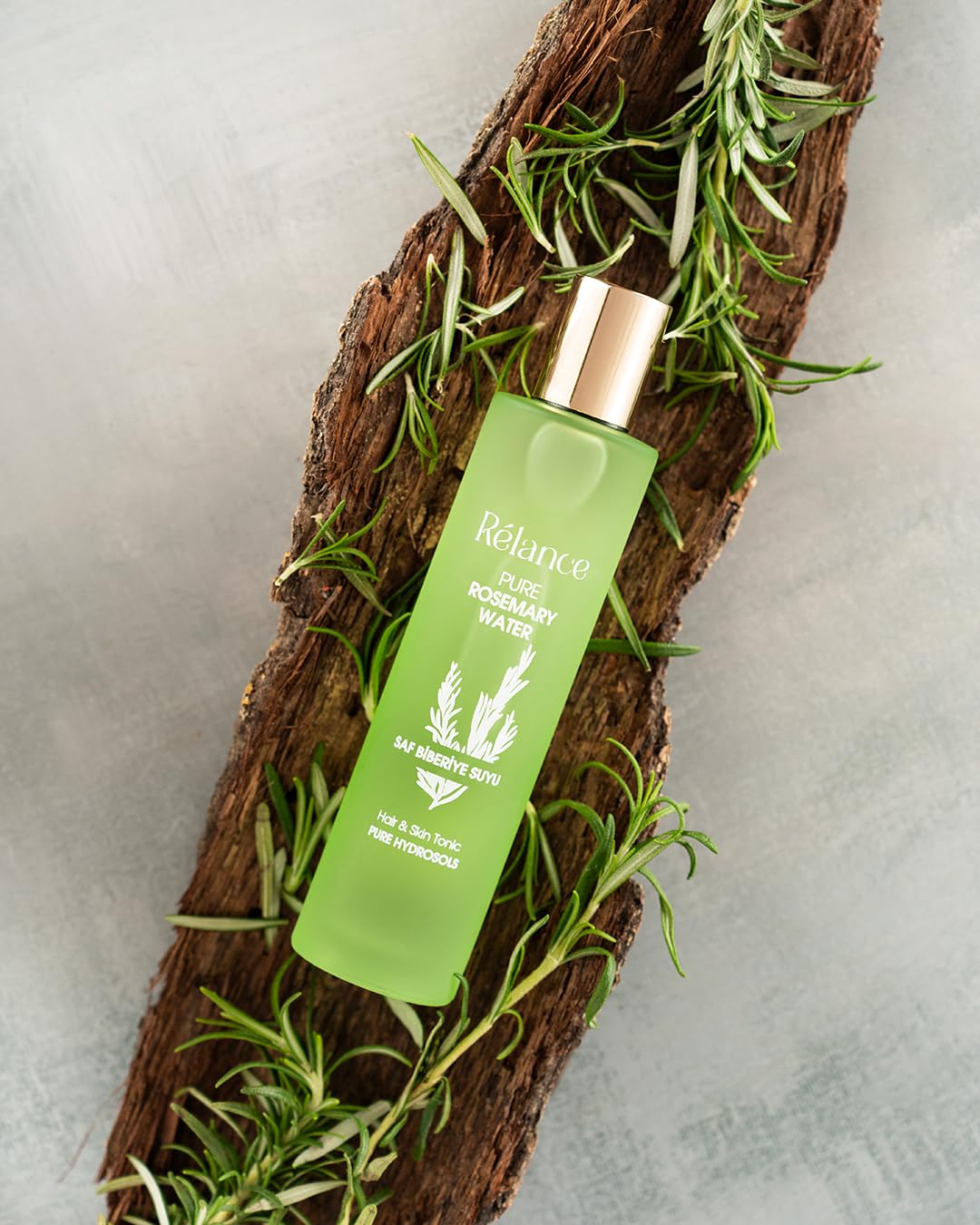 Relance puremary original rosemary water mist being sprayed for scalp nourishment and root strengthening