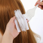 TIESOME end papers for hot and cold perms being applied to hair rollers.