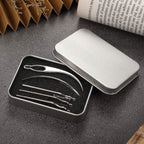 Hand holding a silver interlocking needle demonstrating hair tool dimensions