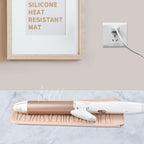 Flexible silicone hair tool storage organizer being washed under warm running water