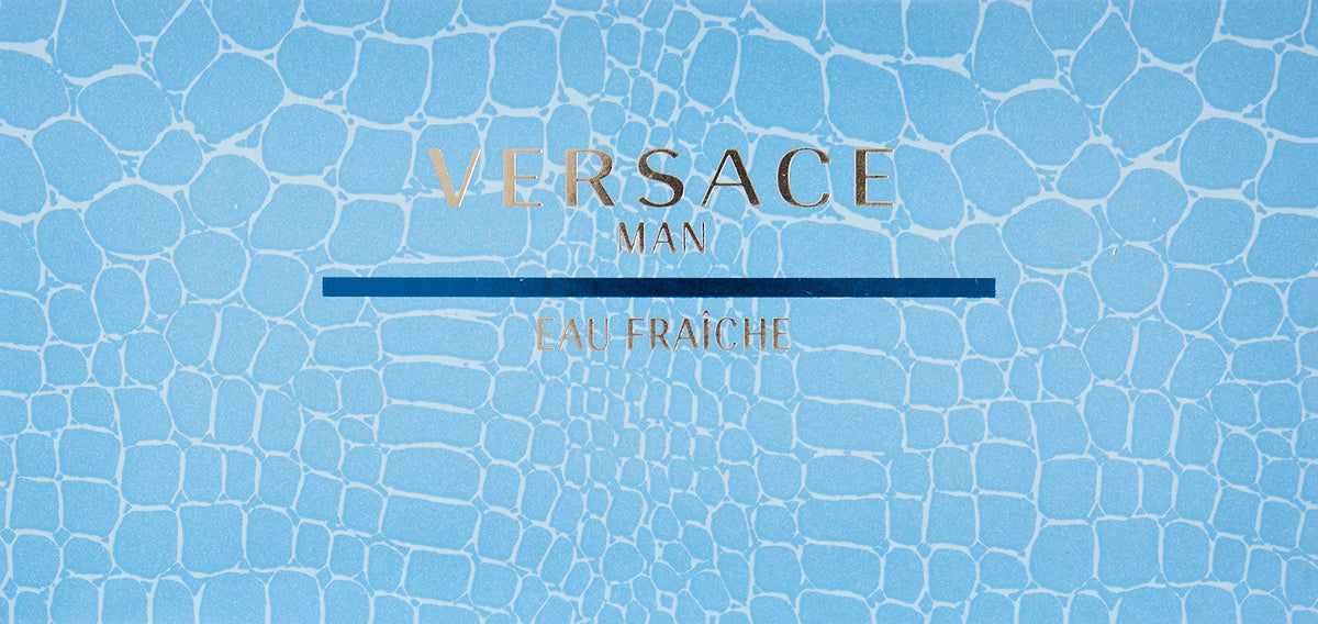 Close up shot of the Versace miniature Eau De Toilette splash bottle next to the blue luxury presentation box.