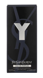 The outer black box packaging of Yves Saint Laurent Y Eau de Parfum for men next to the fragrance spray.