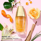 Estée Lauder Beautiful floral women perfume bottle showing the gold cap and clear glass detailing