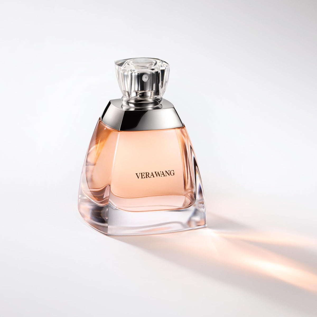 Vera Wang luxury women fragrance bottle highlighting the embossed brand name text