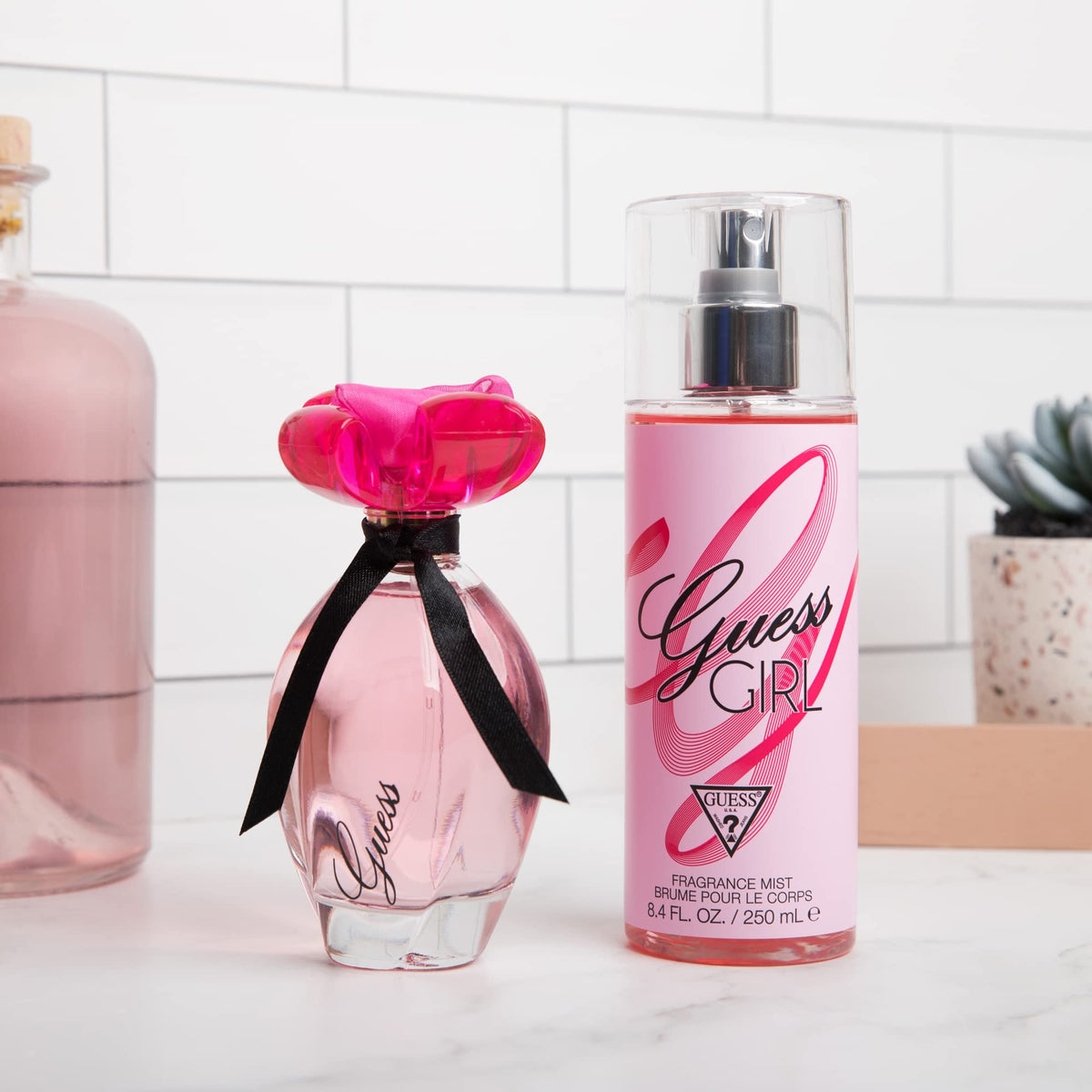 Guess Girl fragrance pink cap design close up