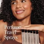 DIME Beauty luxury travel size perfume for women held in hand for scale.
