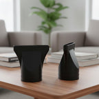 A pair of universal black hair dryer replacement parts laid flat to show the exact dimensions and durable material texture.