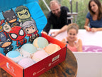 Cosmetics Stories thirty seven ounce superhero gift set open box view revealing six neatly placed large fizzy bath balls